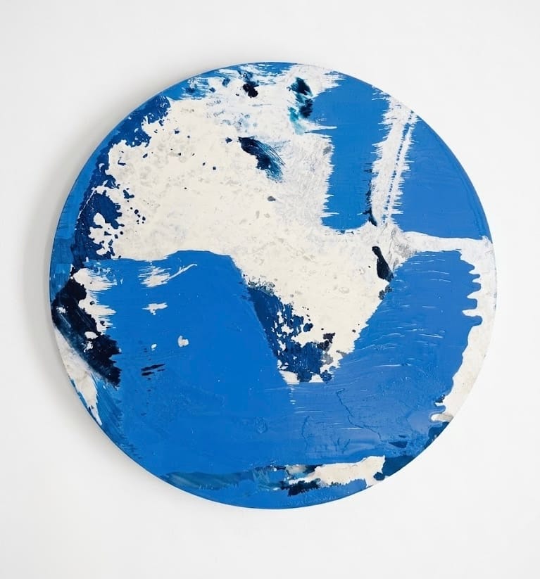 A circular abstract map featuring a bold blue and white color scheme.