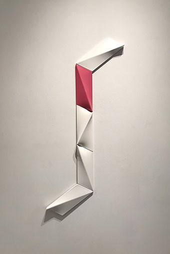 a white wall with a red and white letter j on it