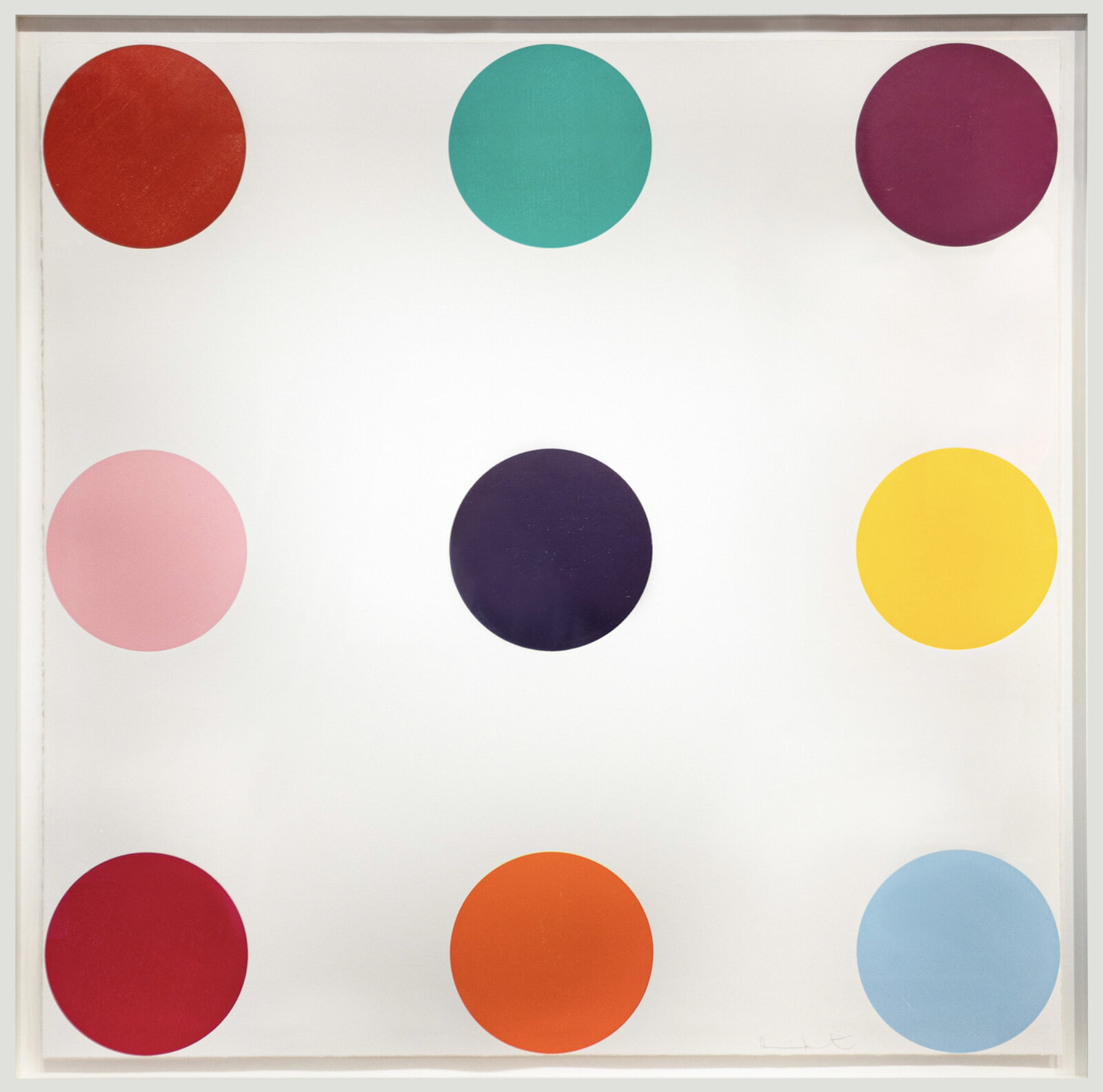 A minimalist composition of nine colored circles arranged in a grid on a white background.