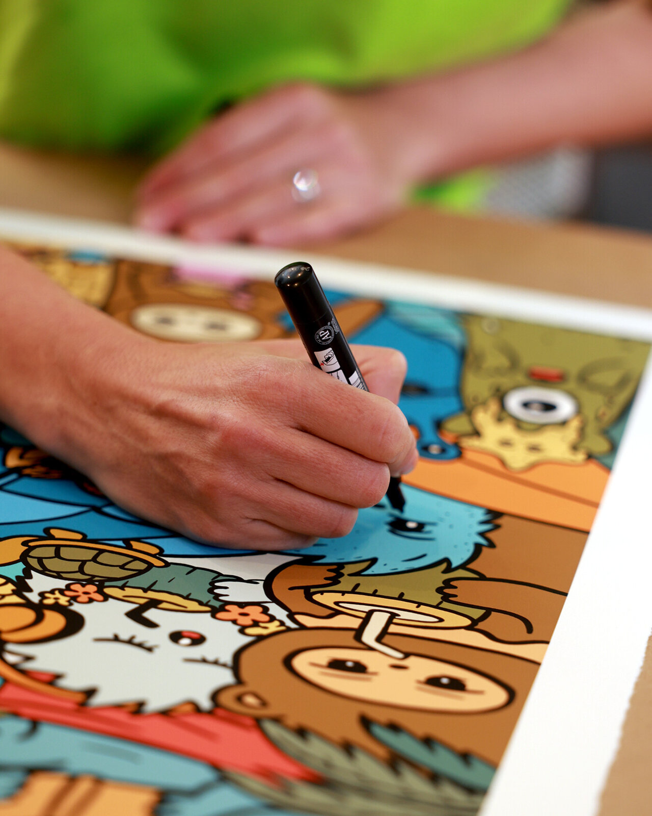 A vibrant, crowded illustration of a beach party featuring numerous whimsical characters enjoying summer activities.