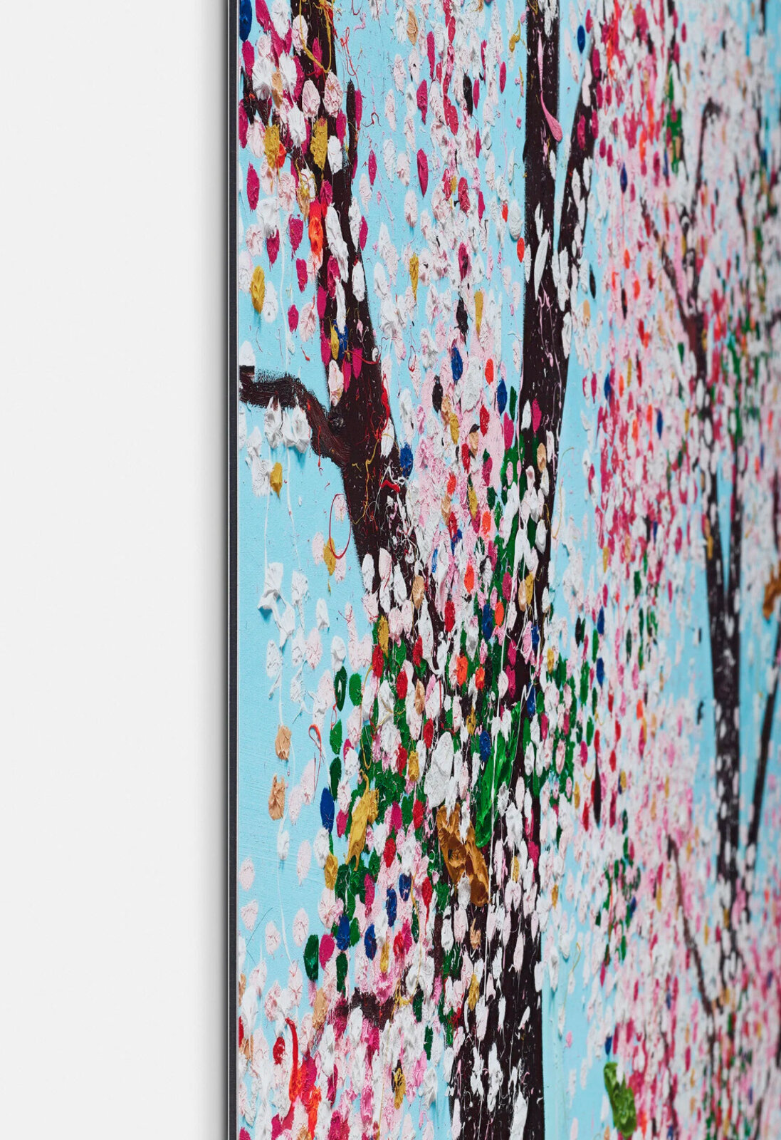 A vibrant, textured painting of blooming trees against a bright blue sky.