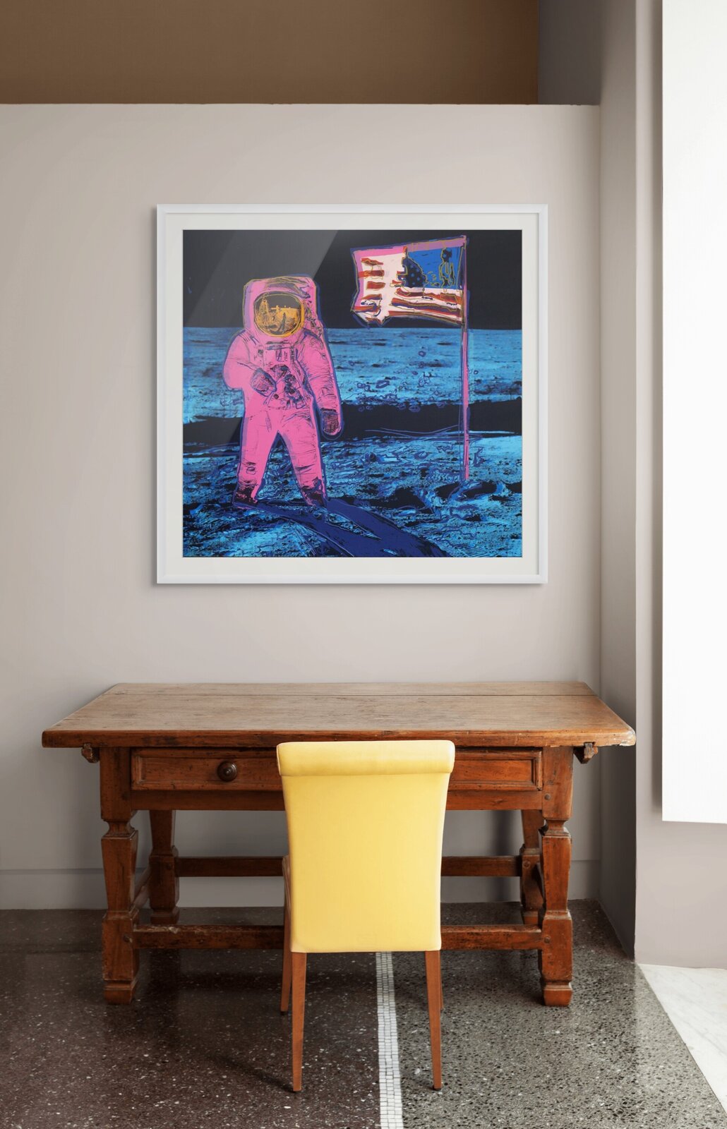 A pop-art style print of a figure in a spacesuit standing on a barren landscape next to a flag.