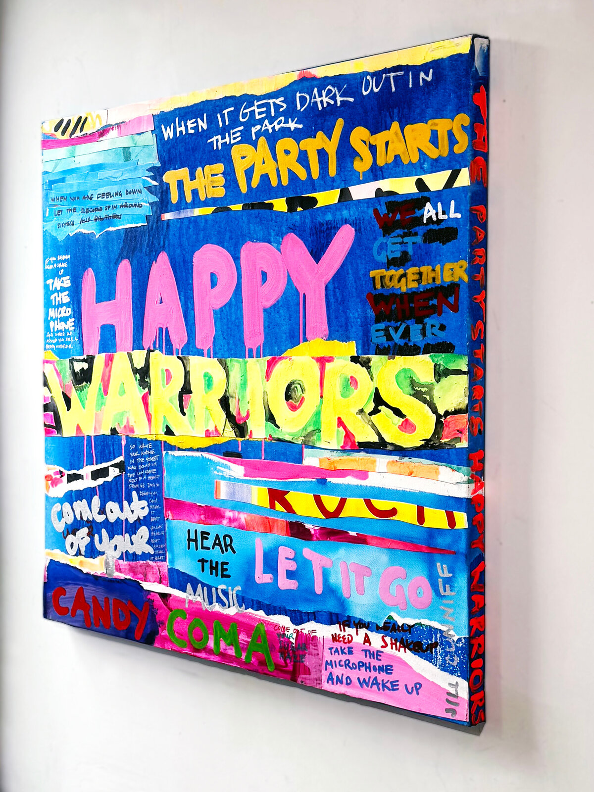 A chaotic, colorful collage of text and paint splatters on a blue background.