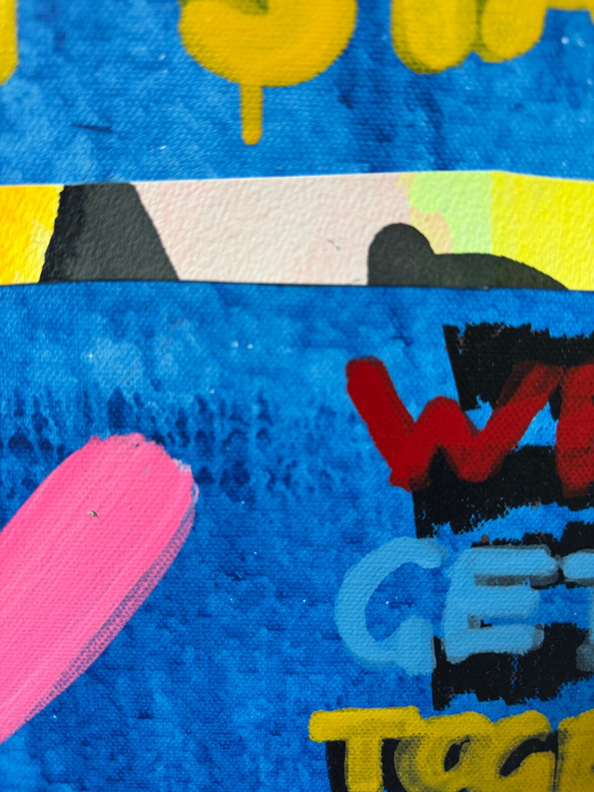 A chaotic, colorful collage of text and paint splatters on a blue background.