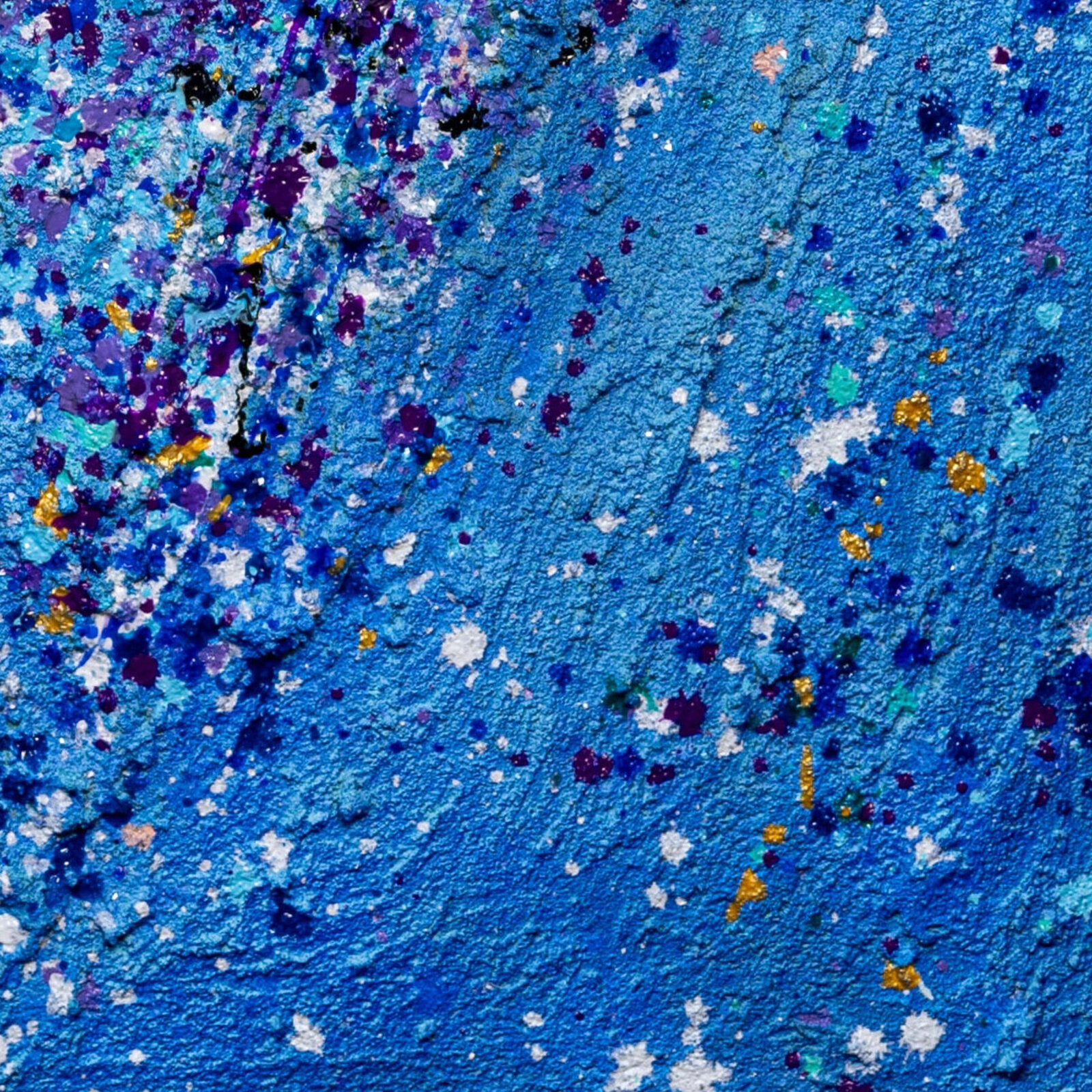 A textured abstract composition featuring a heart shape formed by splattered paint.