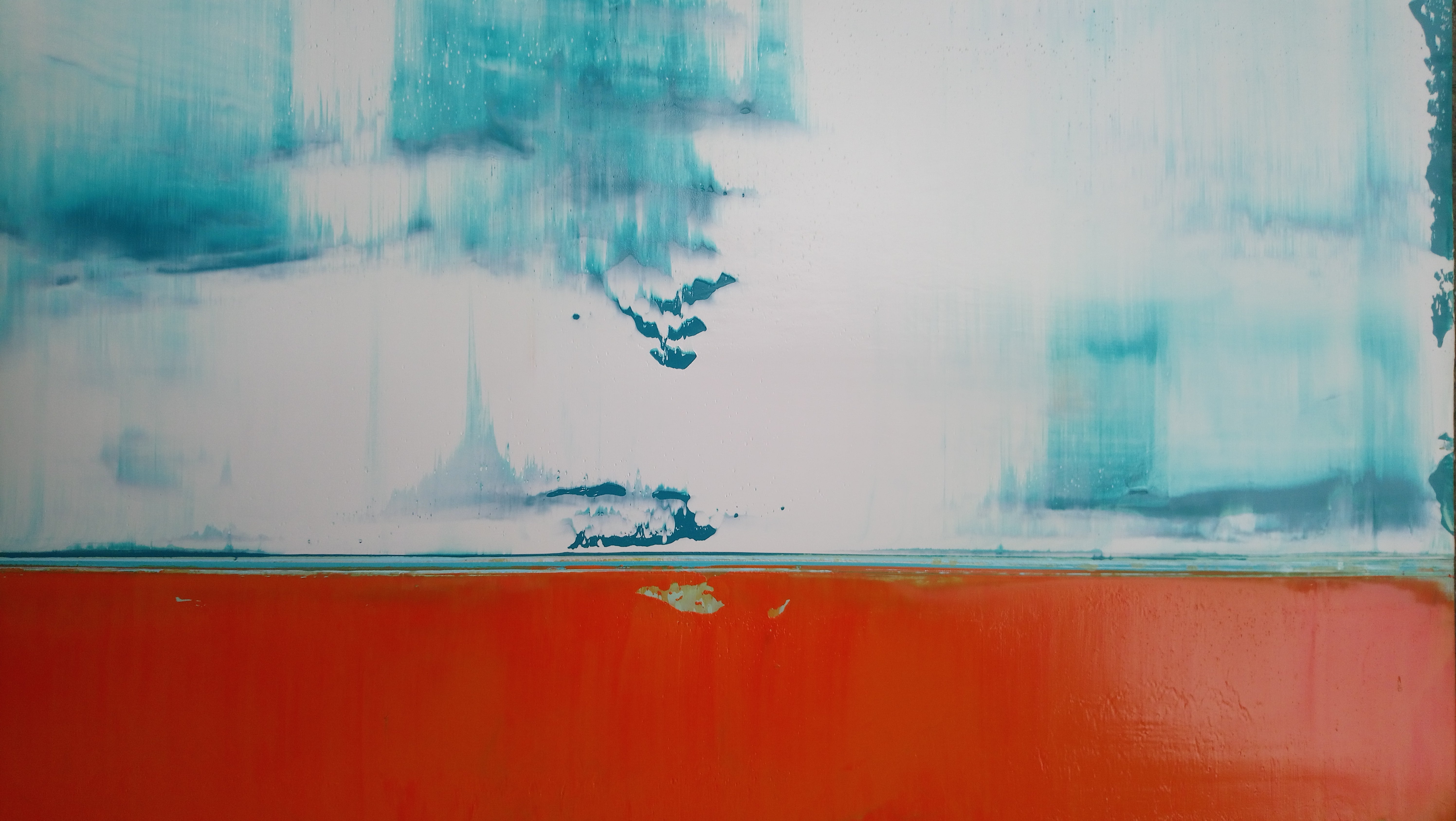 A painting of an orange and blue painting on a white wall.