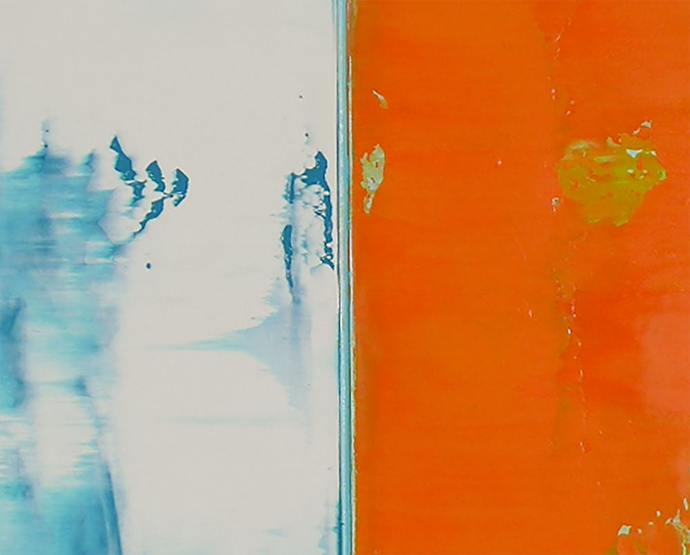 A painting of an orange and blue painting on a white wall.