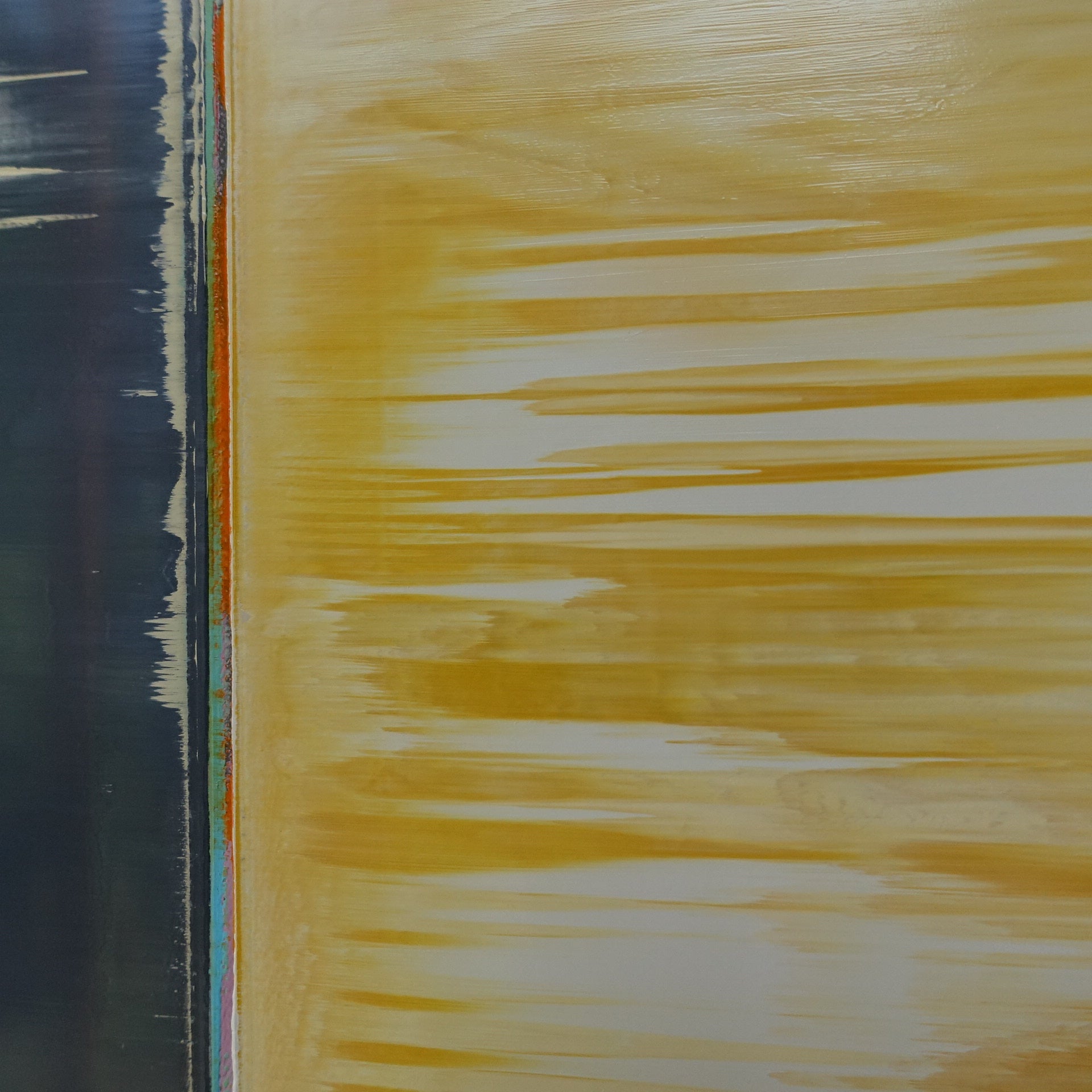 A painting of a yellow and blue painting on a white wall.