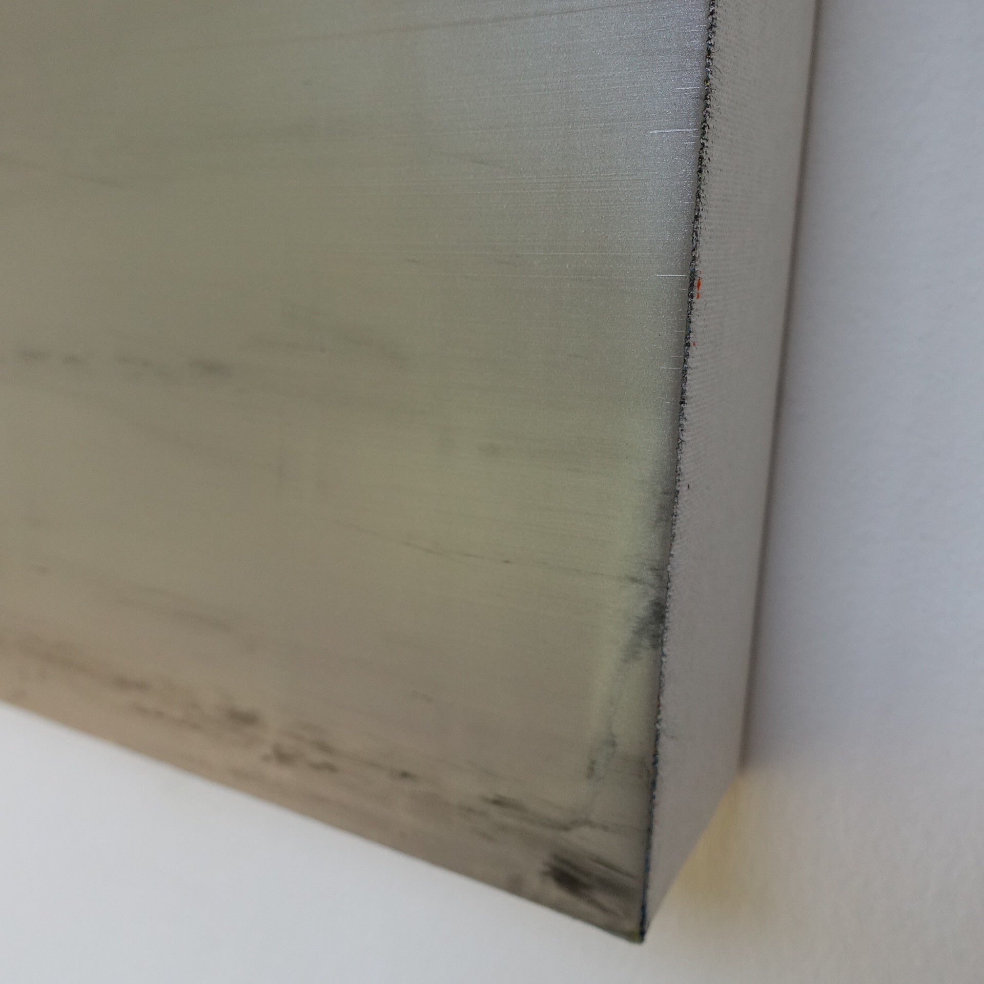 A painting with a blue and gray color block on a white background.