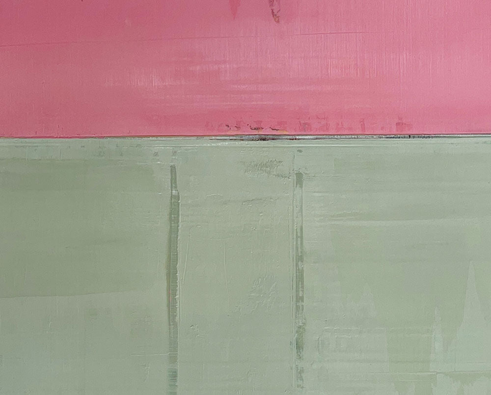 A pink and green painting on a white wall.