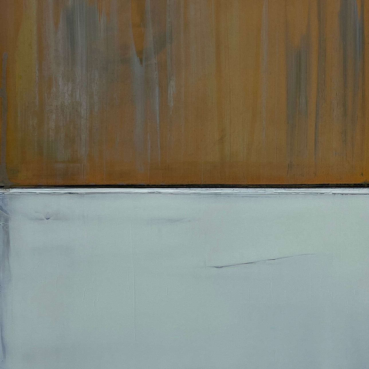 A painting of a yellow and gray painting on a white wall.