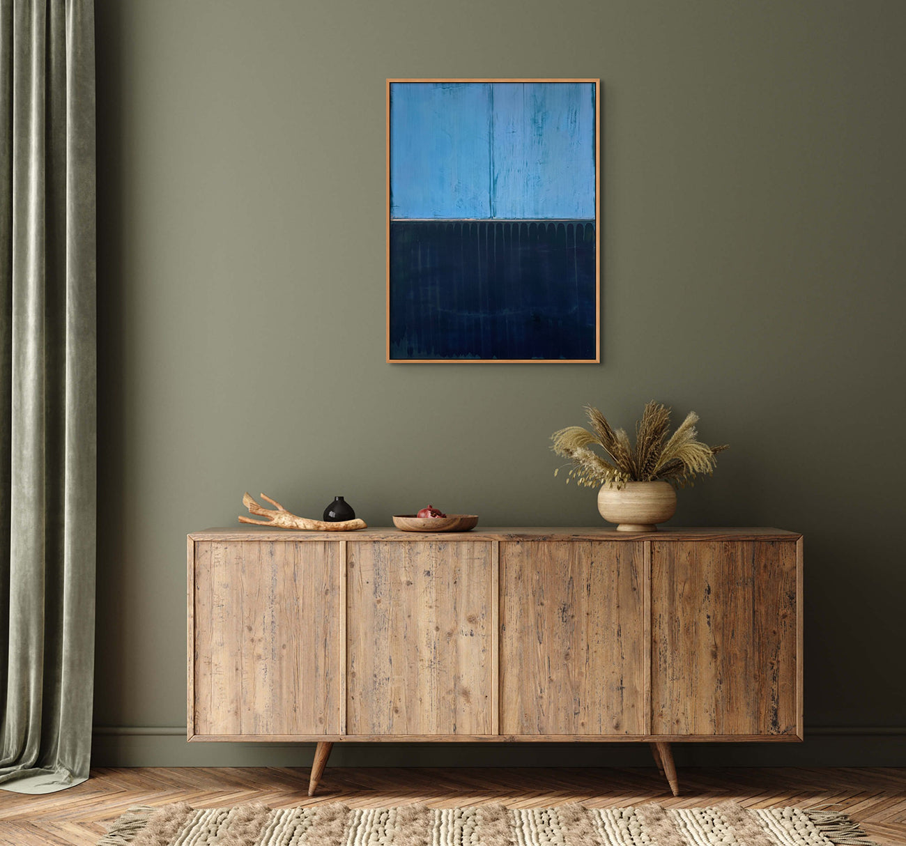 A painting of a blue and black painting on a white wall.