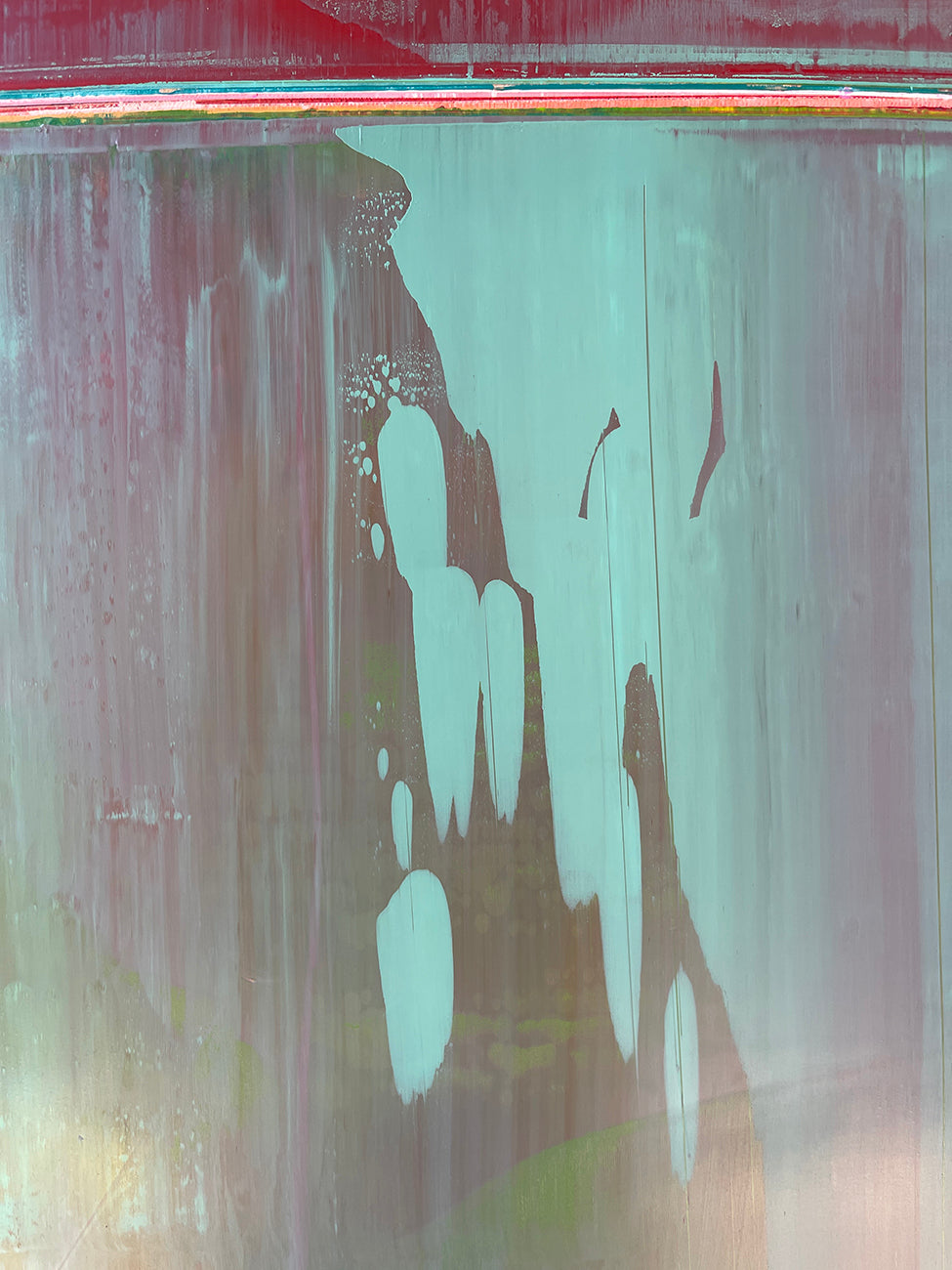 A painting with red and green paint on it. 