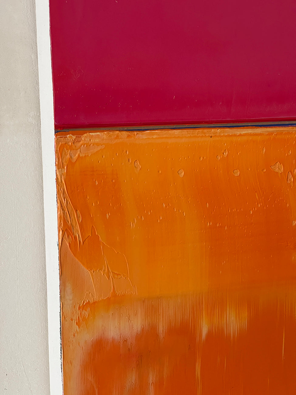 A painting of a pink and orange painting on a white background.