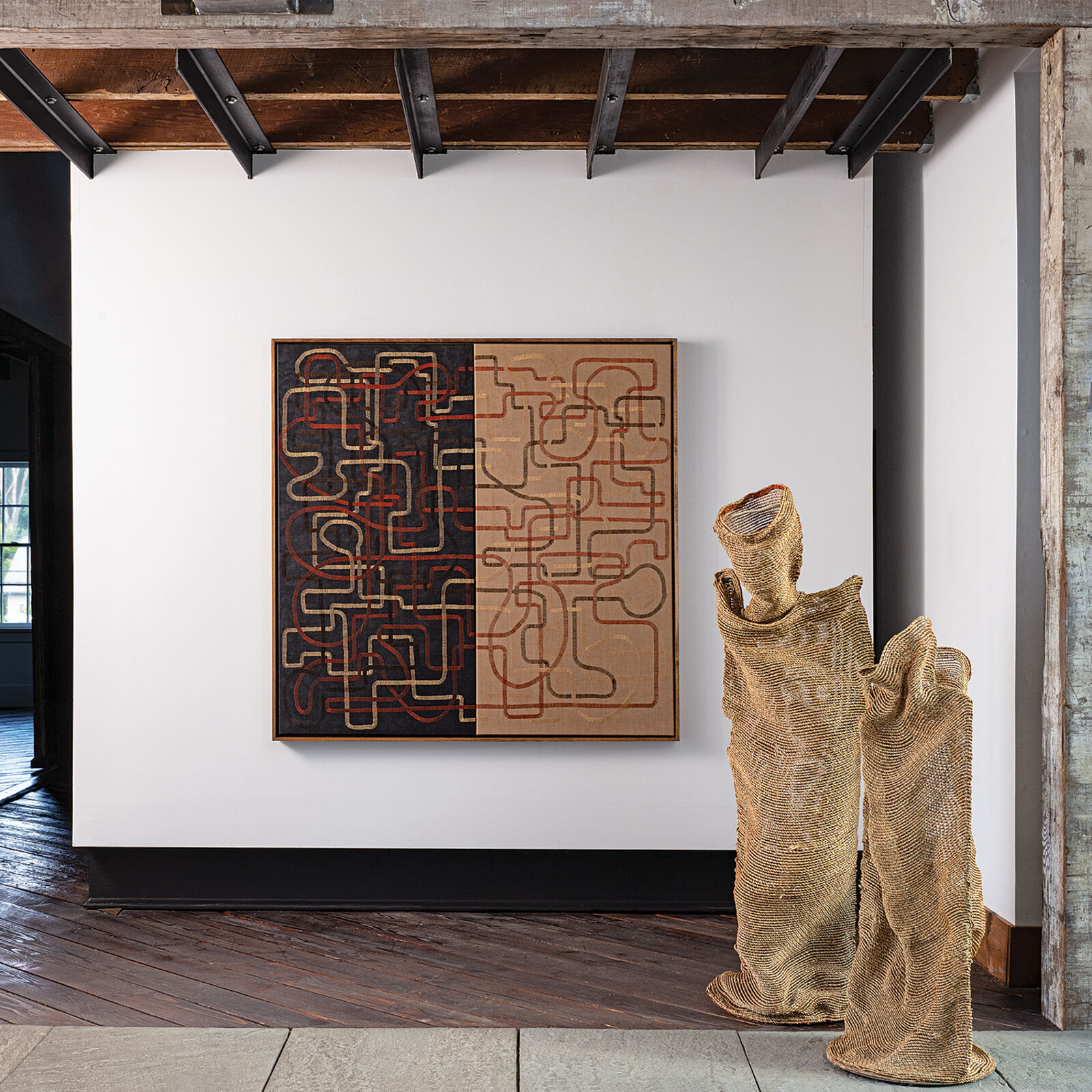 A painting hanging on a wall in a room.