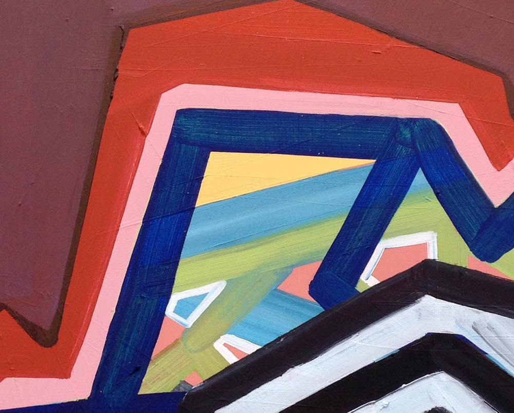 A painting on a red wall with a geometric design.