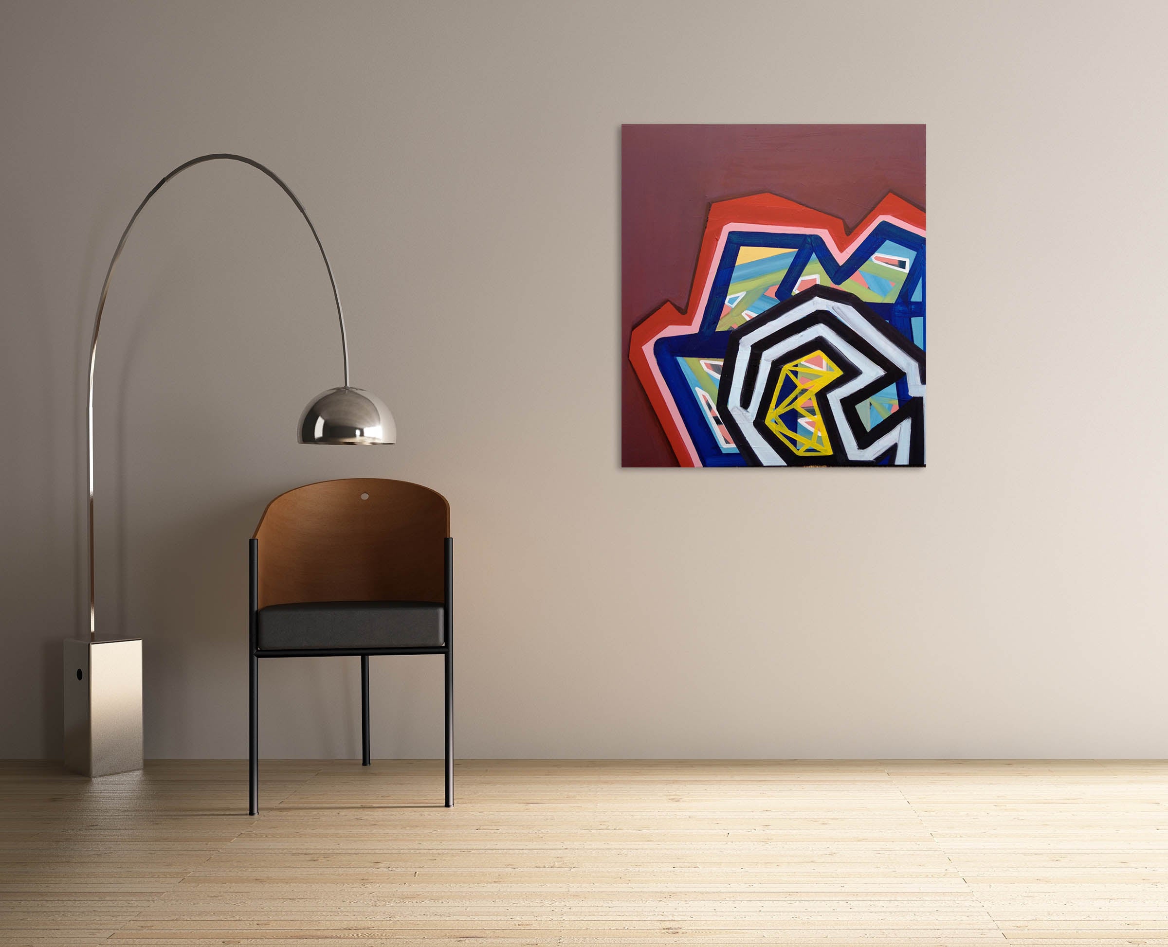 A painting on a red wall with a geometric design.