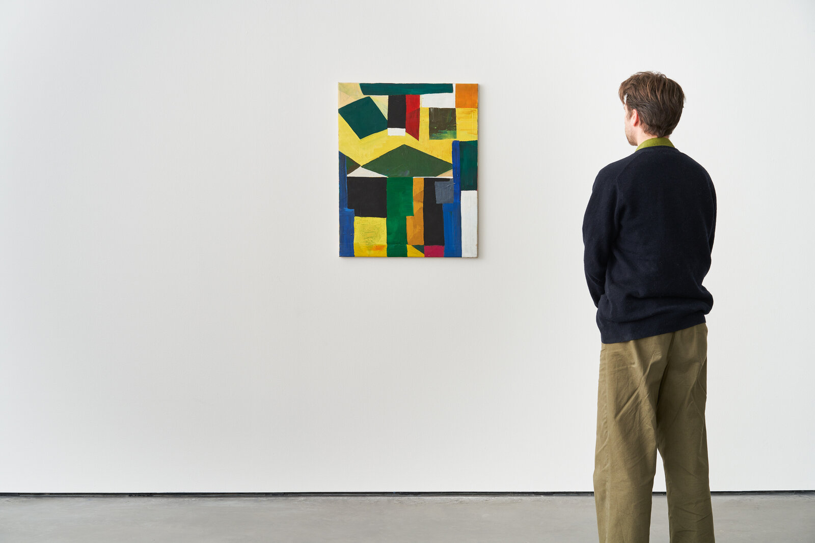 A vibrant abstract painting featuring bold geometric shapes and a dynamic color palette.