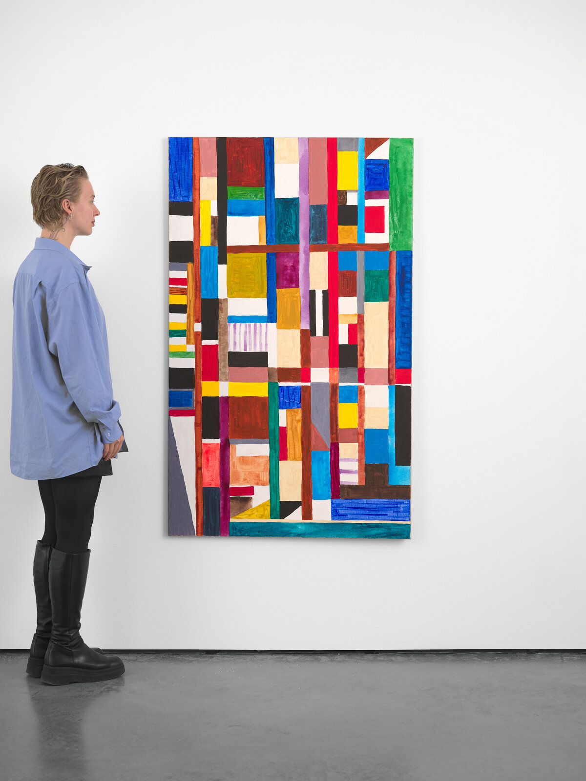 A vibrant abstract painting featuring a grid of colorful geometric shapes.