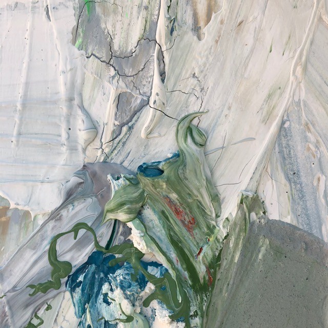 A close up of a painting on a wall. 