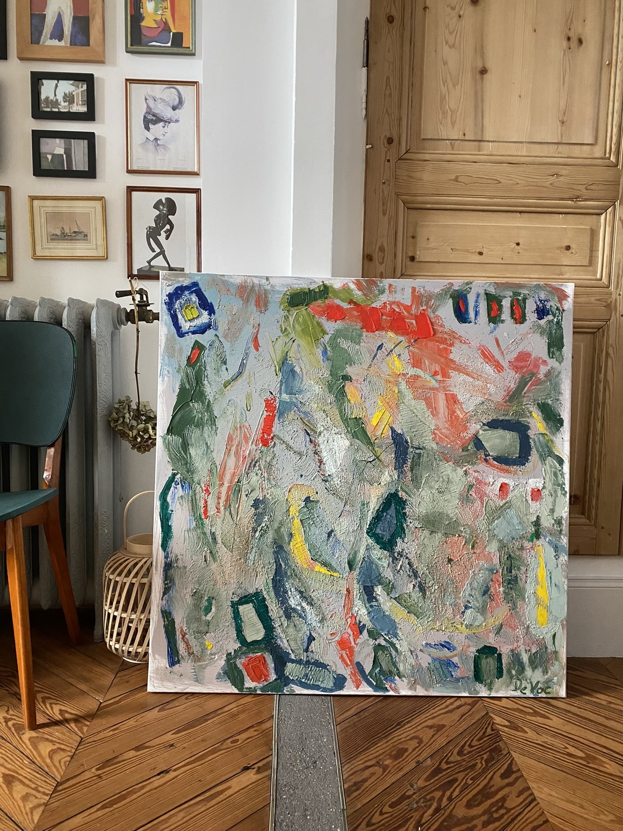 A painting of a vase of flowers on a table.