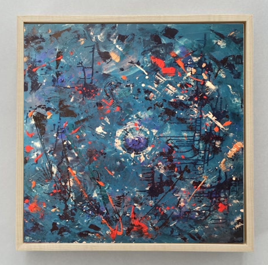 A painting hanging on a wall in a room.