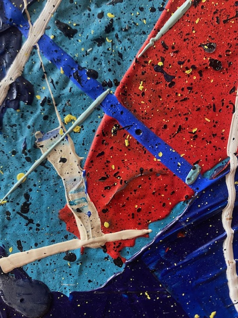 A close up of a painting on a piece of art.