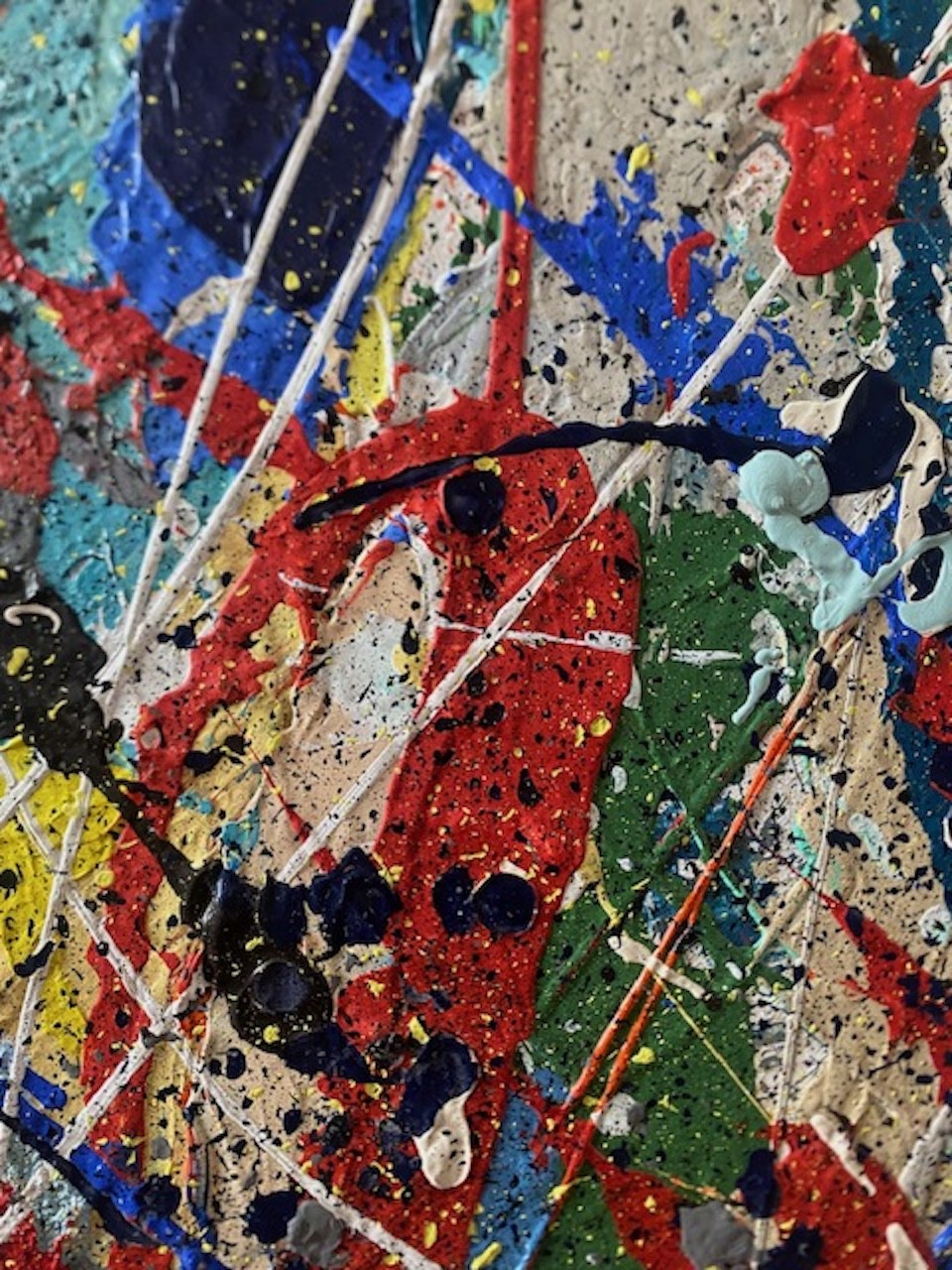 A close up of a painting on a piece of art.