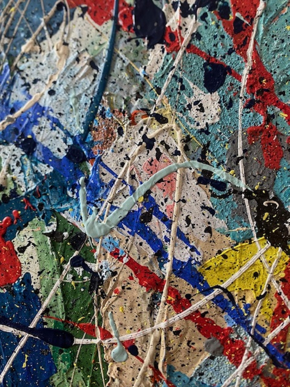 A close up of a painting on a piece of art.
