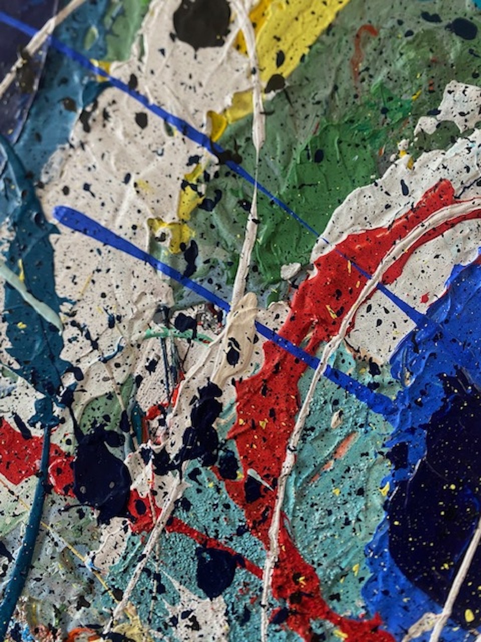 A close up of a painting on a piece of art.