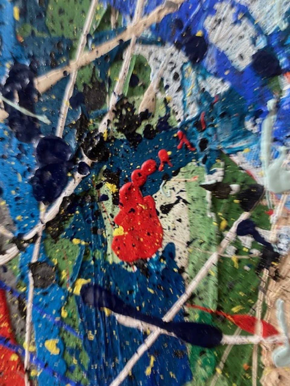 A close up of a painting on a piece of art.