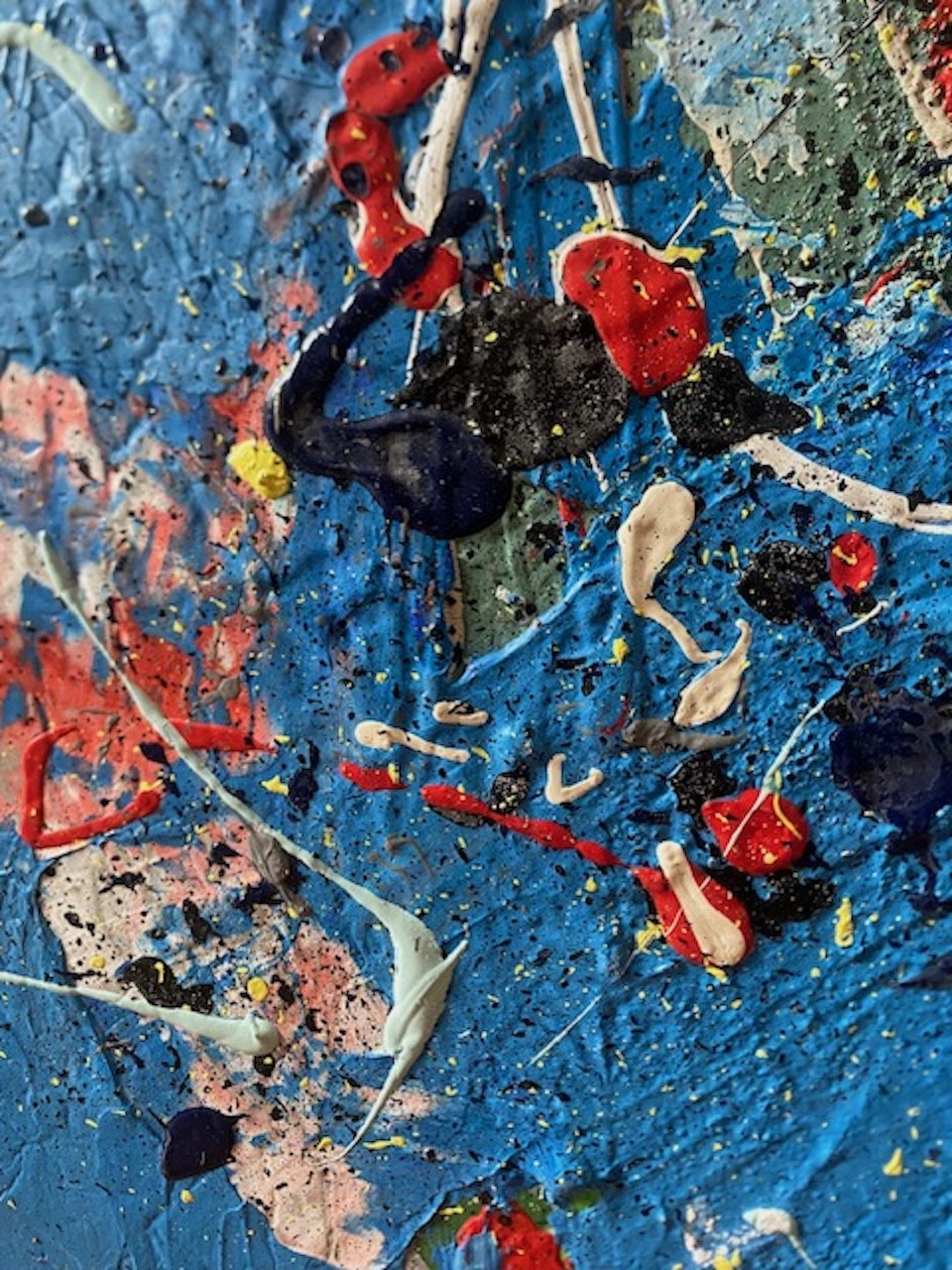 A close up of a painting on a piece of art.