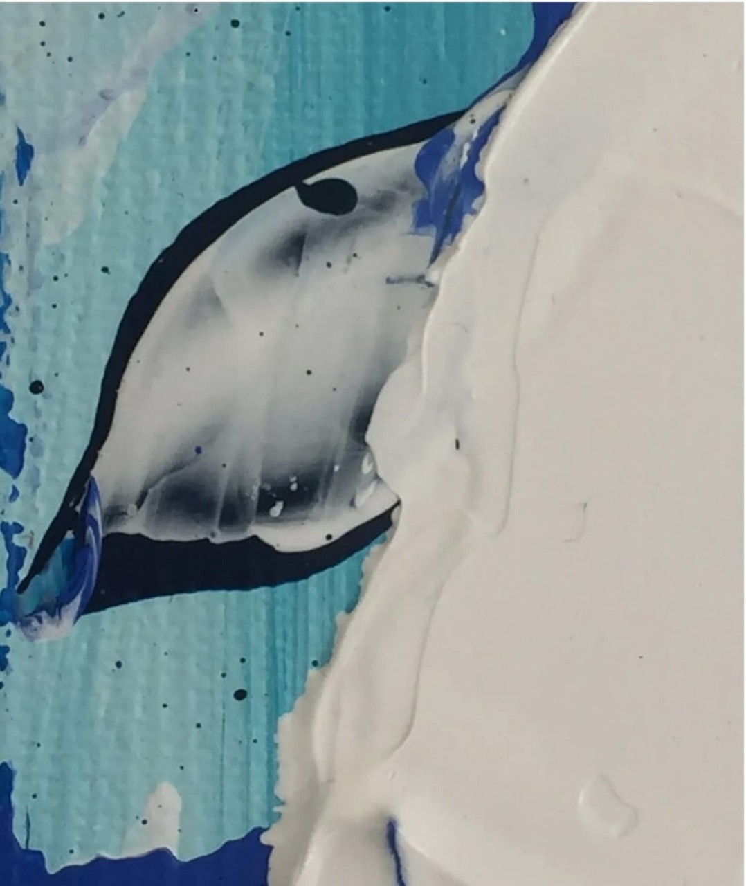 A close up of a blue and white bath bomb.