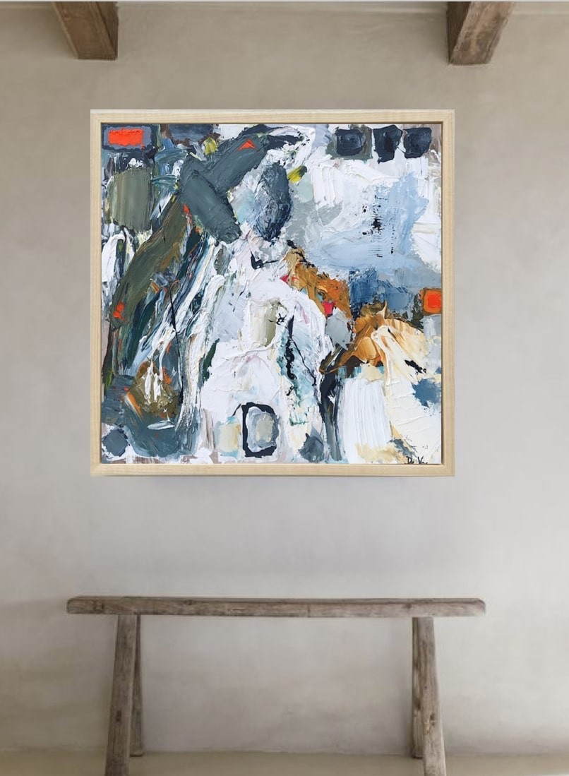 A painting of a horse in a wooden frame.