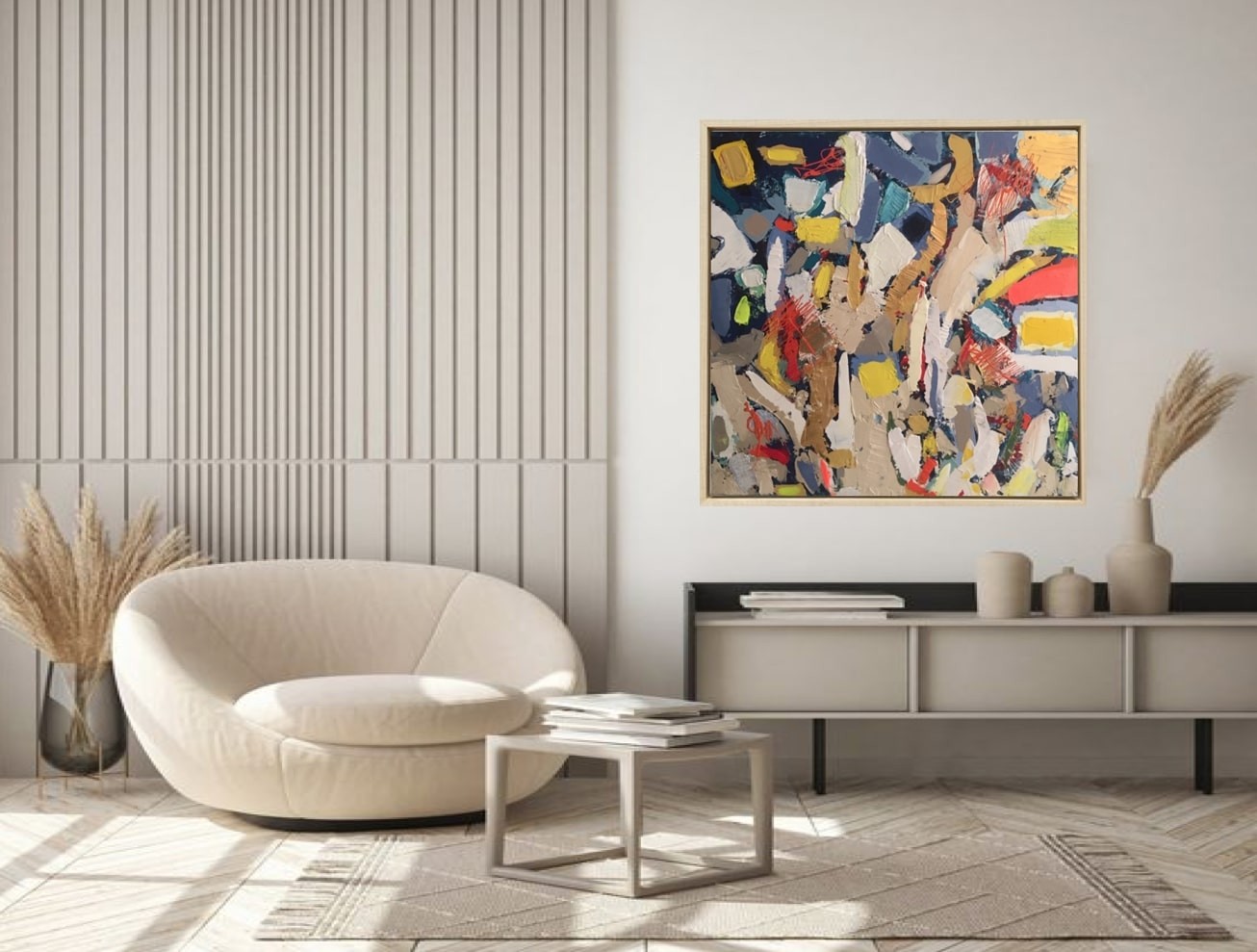 A painting in a gold frame on a white wall.