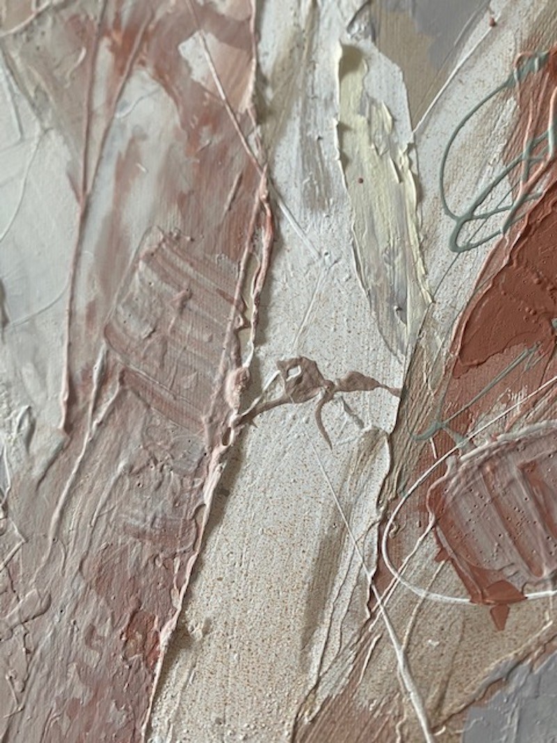 A painting with a wooden frame on a white wall.