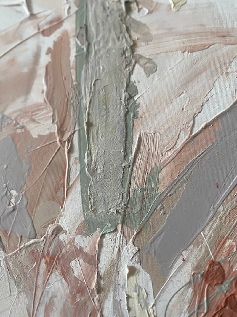 A painting with a wooden frame on a white wall.