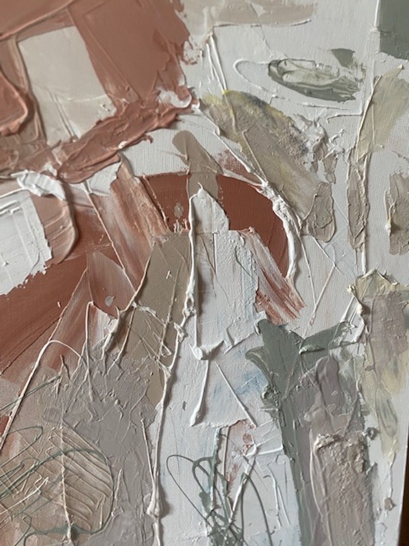 A painting with a wooden frame on a white wall.
