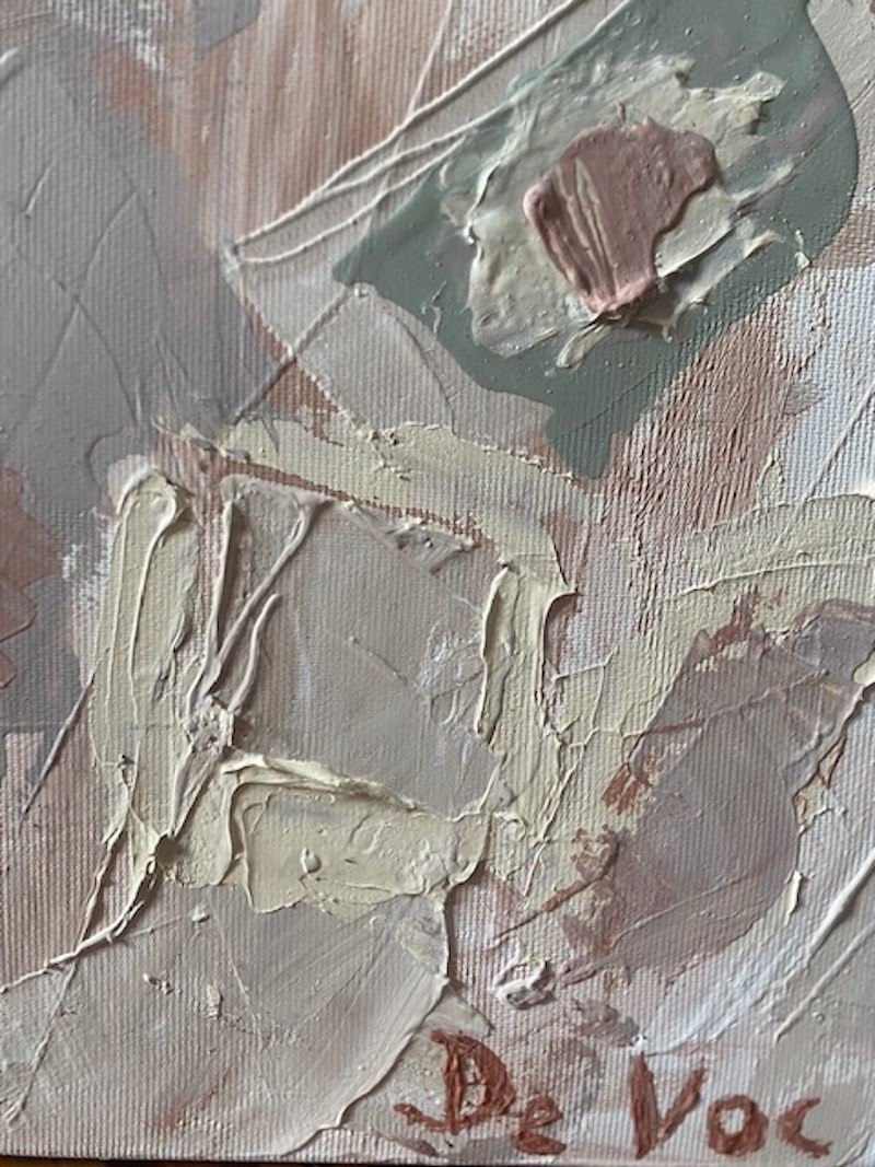 A painting with a wooden frame on a white wall.
