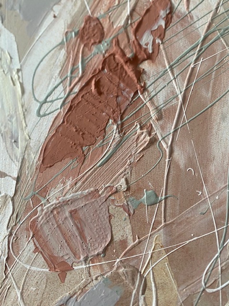 A painting with a wooden frame on a white wall.
