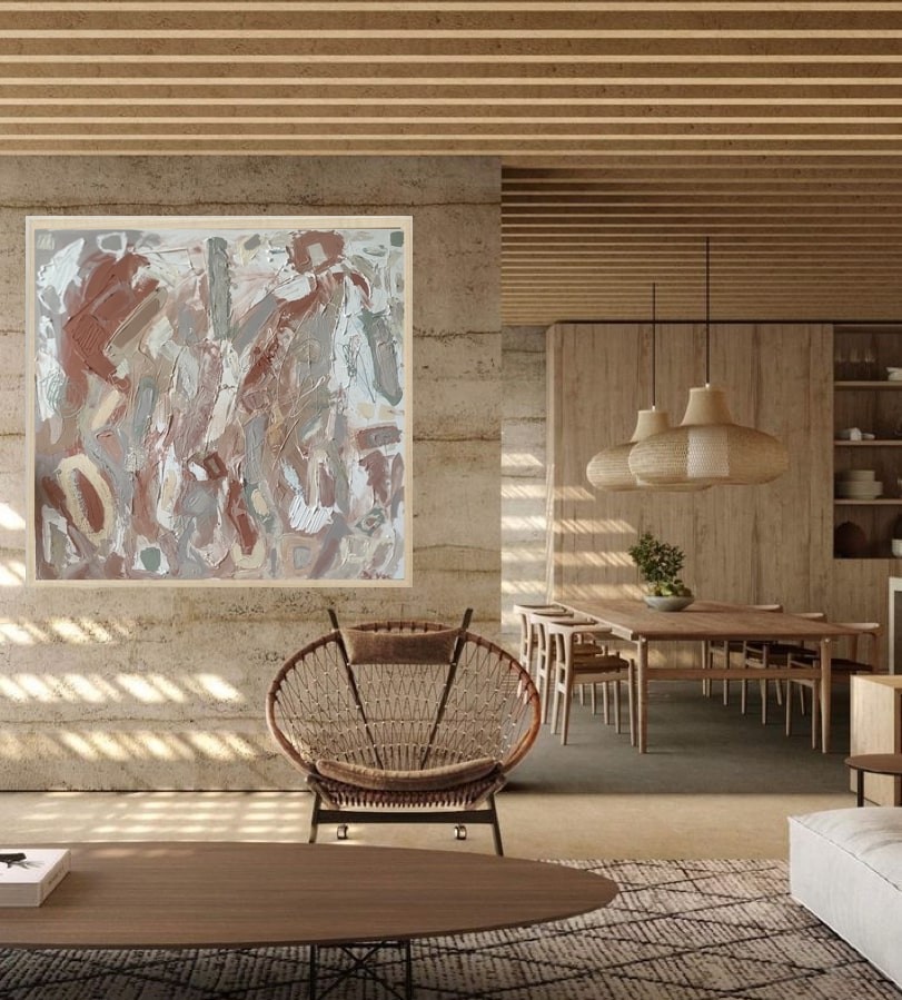 A painting with a wooden frame on a white wall.