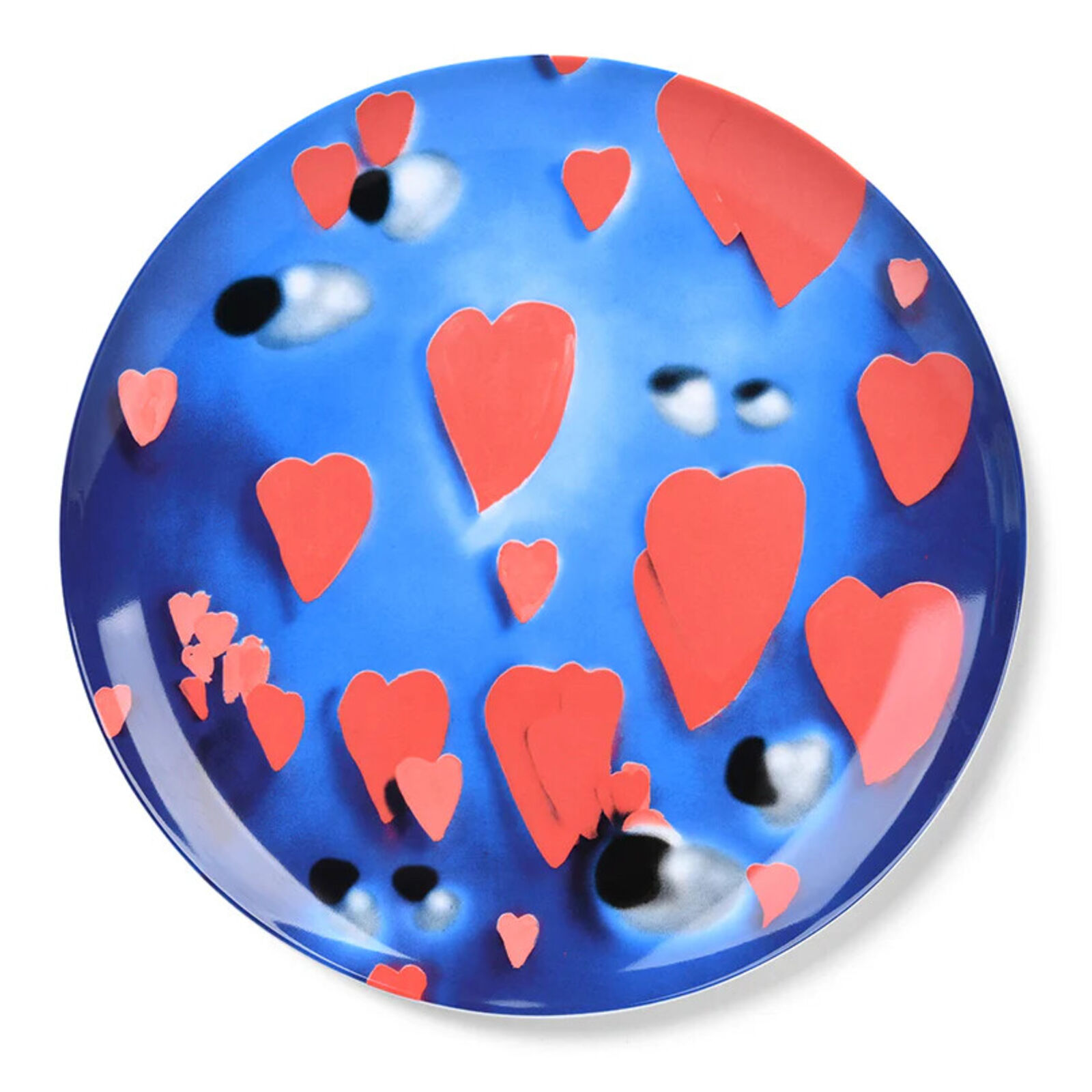 A blue plate with red hearts on it. 