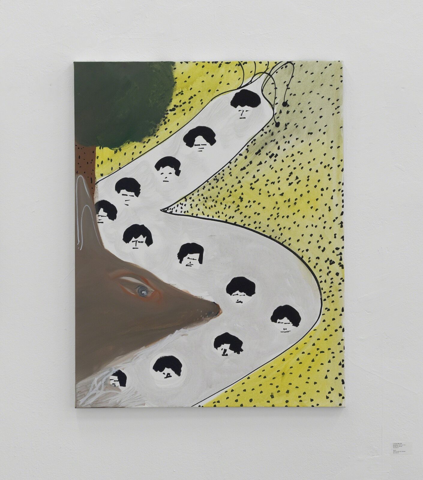 A painting on a wall with a dog's head in the middle of it.