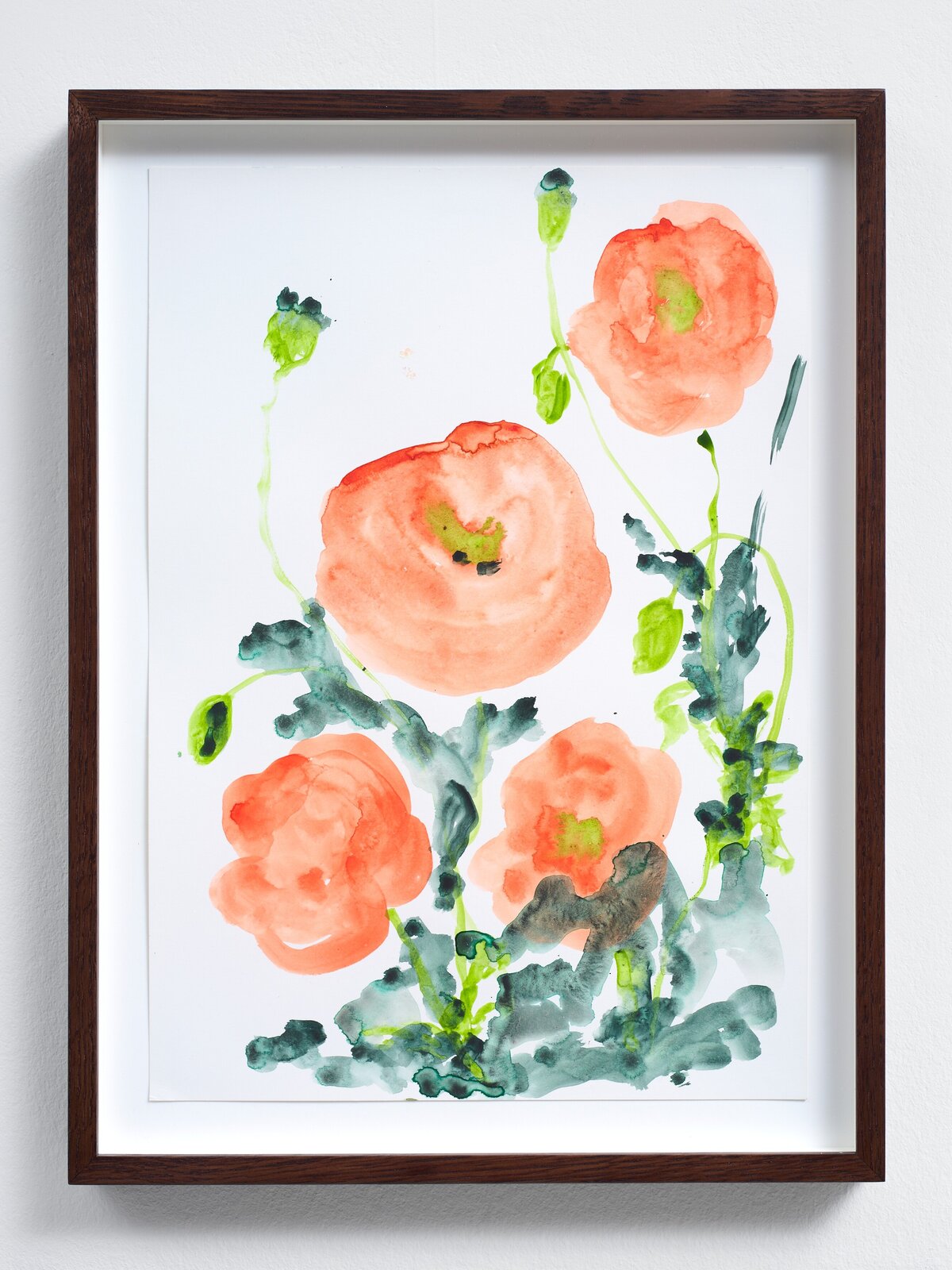 A watercolor floral print featuring coral poppies and green foliage in a dark wood frame.