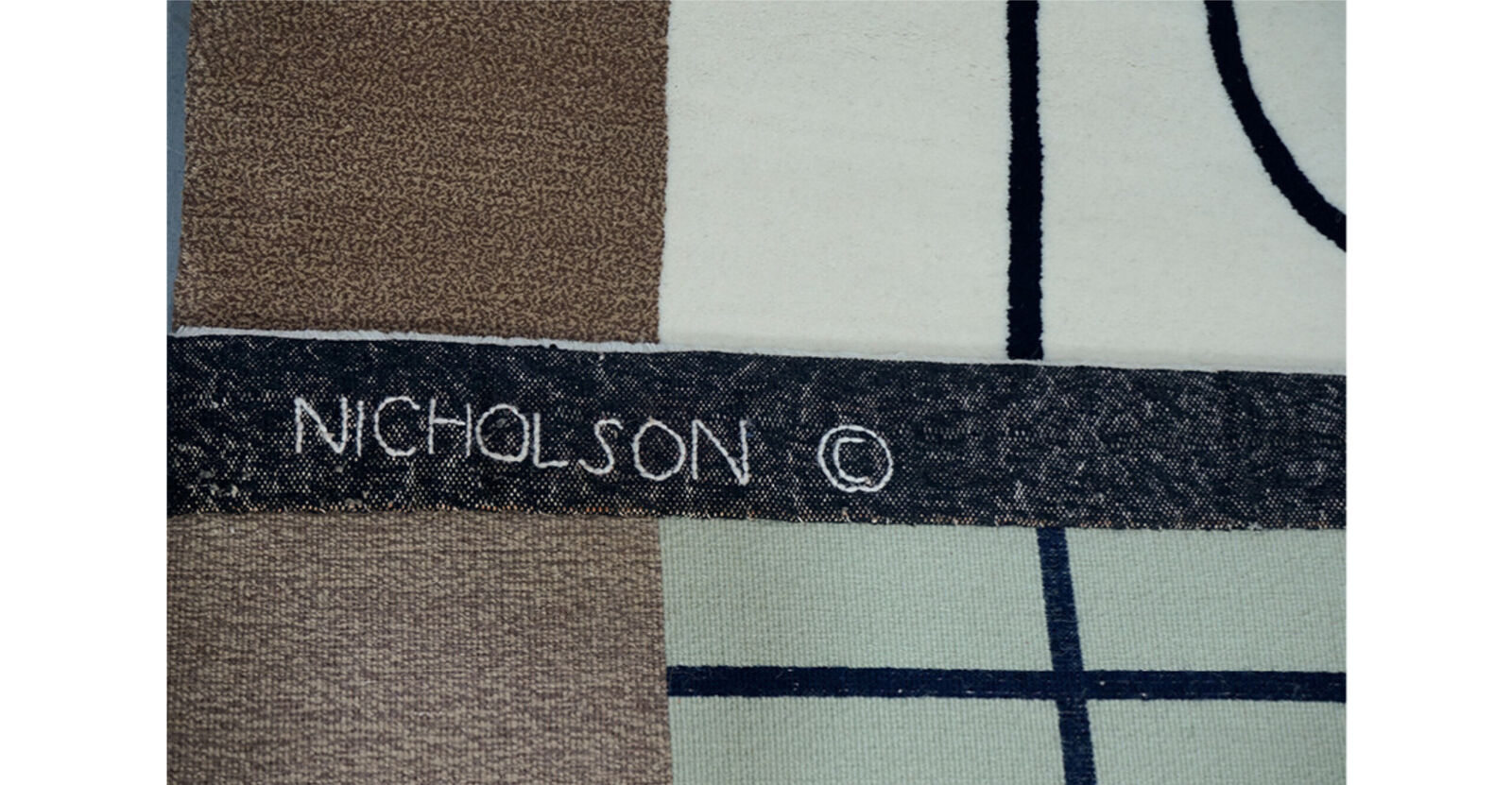 A rug with a geometric design on it. 