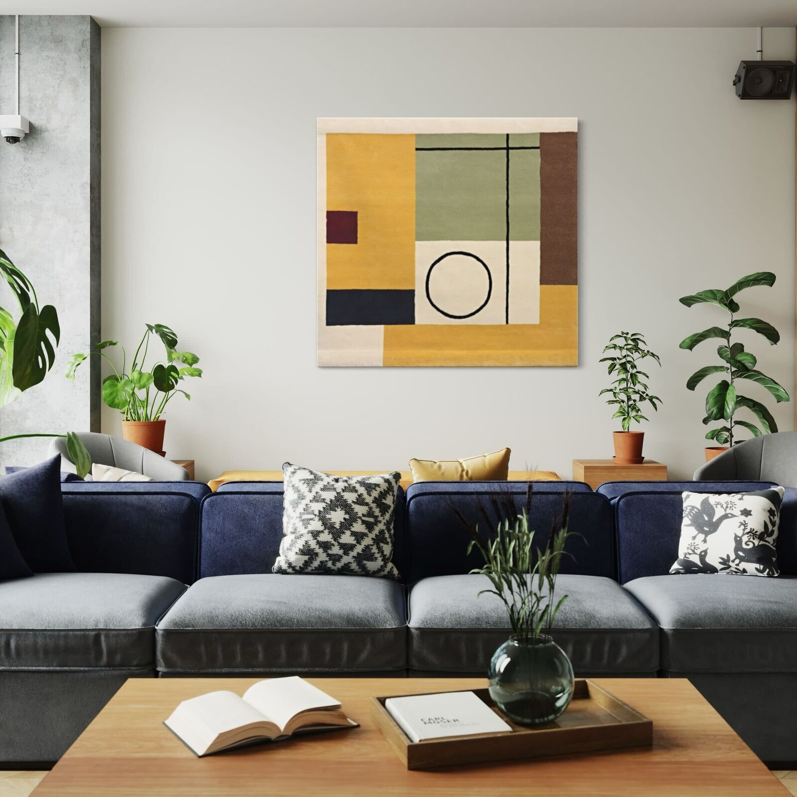 A modern living room featuring a tufted sofa and geometric abstract wall art.