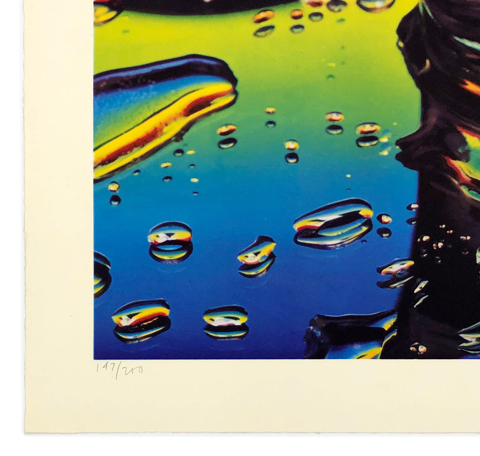 A picture of a glass of soda with the Statue of Liberty in the background.