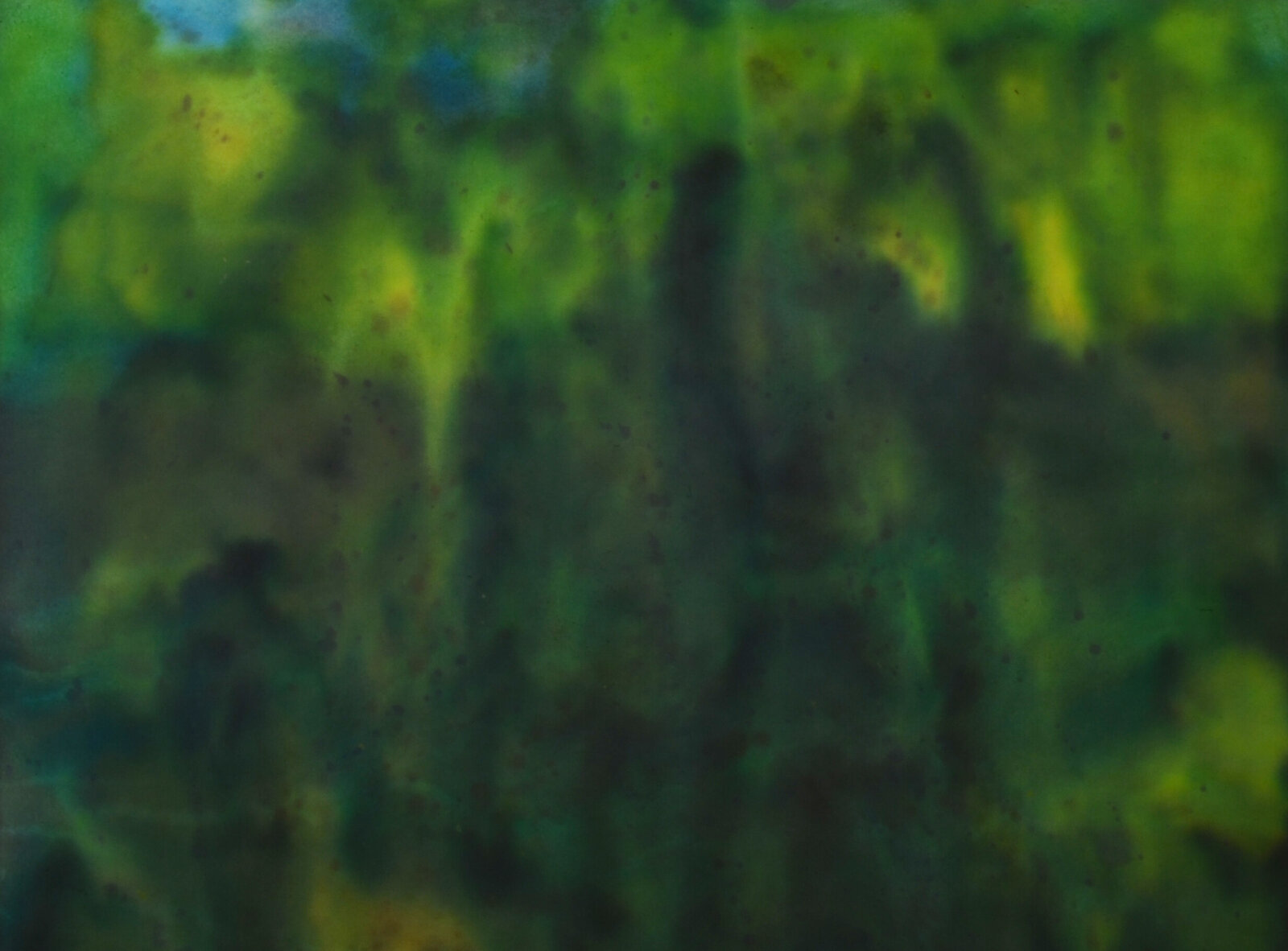 A horizontal abstract composition of seven rectangular panels displaying a spectrum of blended colors.