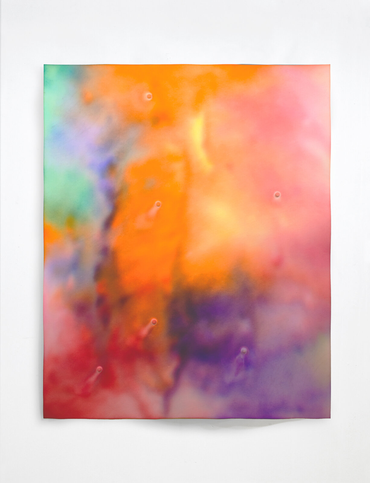 A colorful abstract print featuring a soft, watercolor-like texture with vibrant orange and pink hues.
