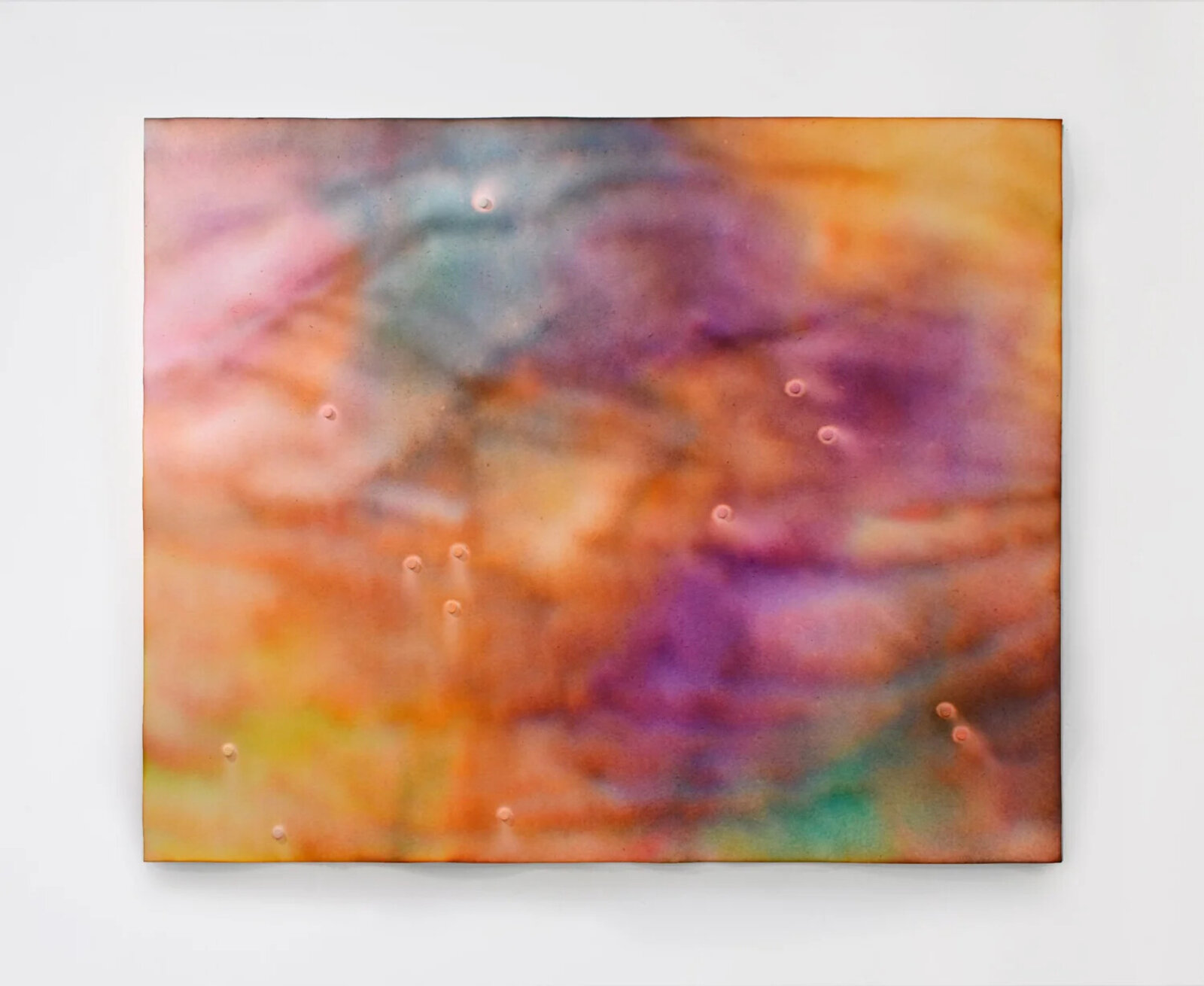 A colorful abstract painting featuring a textured surface with small raised dots.